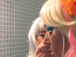Ganguro girl put even more emphasis on their face and hair make-up such as intricate fake eyelashes and colorful eyeshadow.