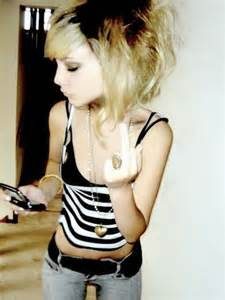 A thin woman flipping off the camera