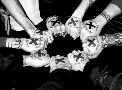 Nine fists next to each other forming a circle. Each fist has a black X on it.